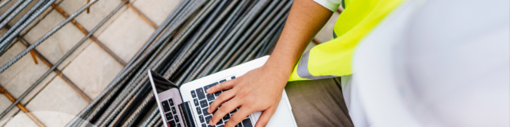 Construction worker using a laptop 